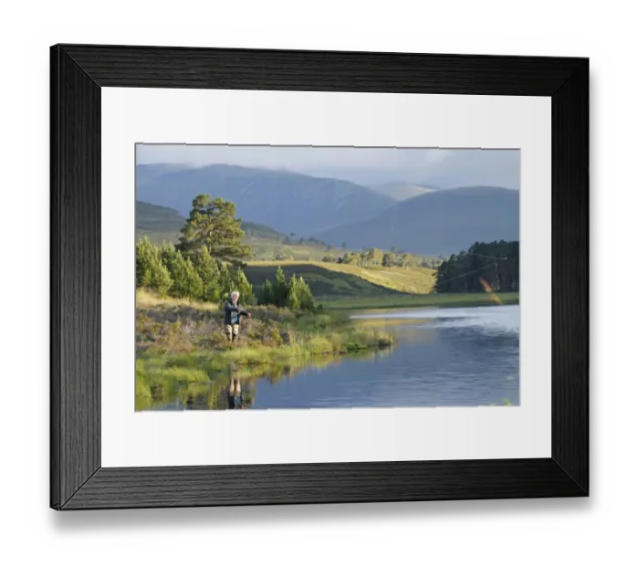 Framed Print : Fly fishing for trout in freshwater loch, Loch a Chnuic, Abernethy Forest, Strathspey, Cairngorms N. P