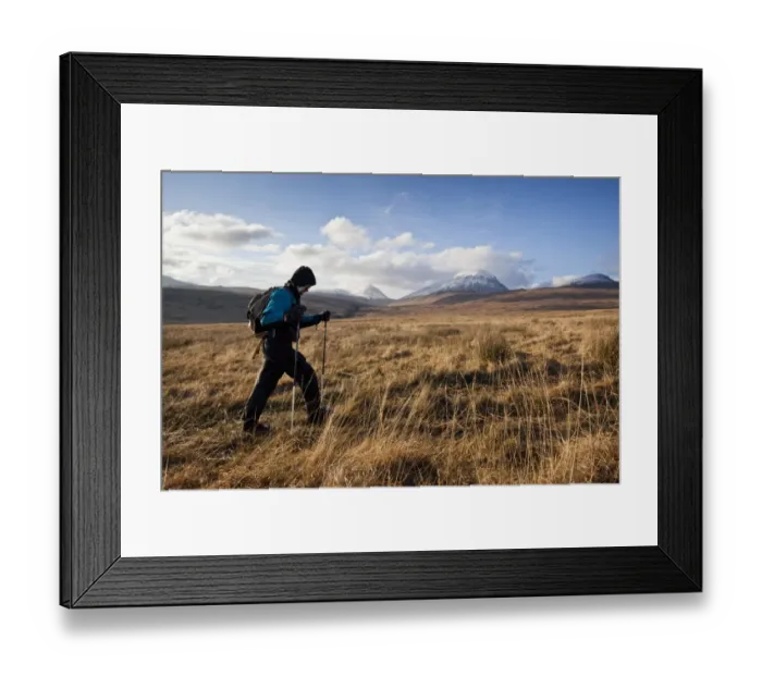 Framed Print : Walker following Evans Walk path on moorland, with snow covered Paps of Jura in background, Isle of Jura Framed Print : Walker following Evans Walk path on moorland, with snow covered Paps of Jura in background, Isle of Jura