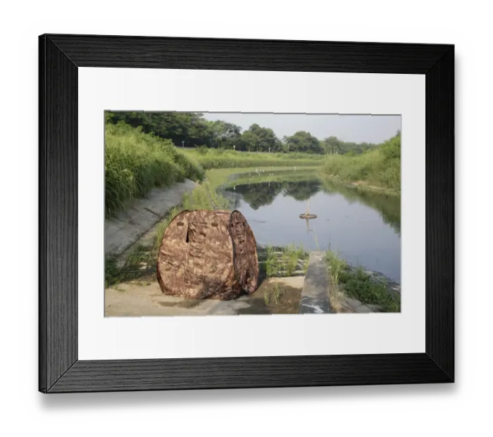 Framed Print : Pop-up hide used by bird photographer at edge of water, Hong Kong, China, October Framed Print : Pop-up hide used by bird photographer at edge of water, Hong Kong, China, October
