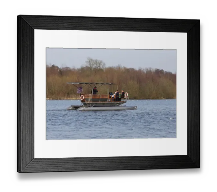 Framed Print : Solar-powered electric boat with tourists on river, Norwich, River Yare, The Broads, Norfolk, England, April Framed Print : Solar-powered electric boat with tourists on river, Norwich, River Yare, The Broads, Norfolk, England, April