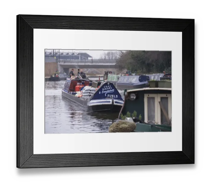 Framed Print : Narrowboat carrying load of fuel on city canal, Regents Canal, Islington, London, England, March Framed Print : Narrowboat carrying load of fuel on city canal, Regents Canal, Islington, London, England, March