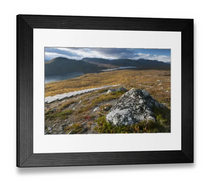 Framed Print : Rock and wooden steps leading to summit of fell, Malla Strict Nature Reserve and Lake Kilpisjarvi in background