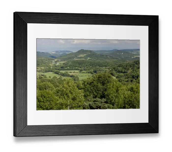 Framed Print : View of rolling wooded volcanic countryside, looking east from Murol, Auvergne, France, August Framed Print : View of rolling wooded volcanic countryside, looking east from Murol, Auvergne, France, August