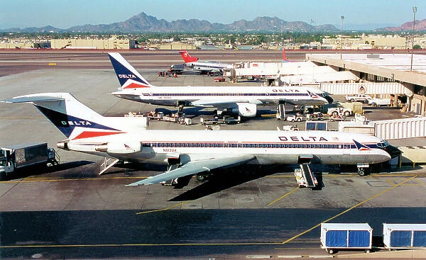 Boeing 727-232 N512DA (msn 21314, line Number 1358). of Delta Airlines at Las Vegas International Airport, with Delta 757 N614DL. Date: circa 1996