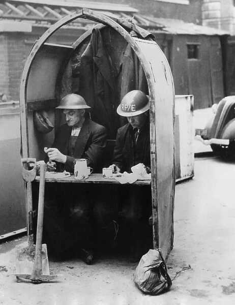 A Cosy Diner - Workmen have lunch amid the air raids
