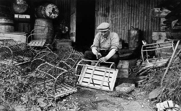 Fisherman making and repairing lobster pots