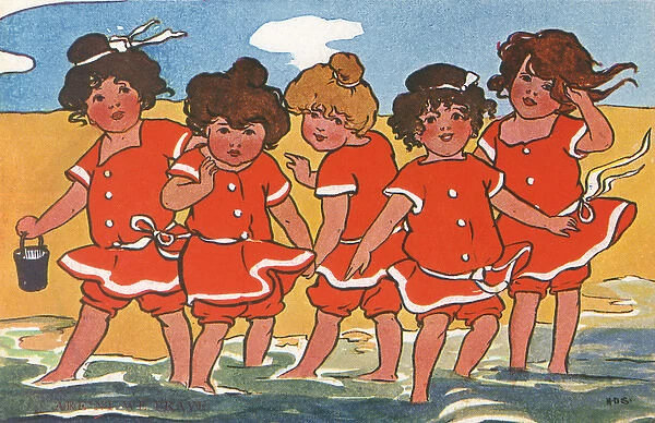 Girls padding in the sea