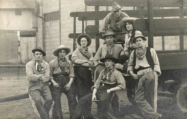 A group of cowboys on the back of a truck