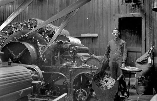 Man in textile industry operating machine, Scotland