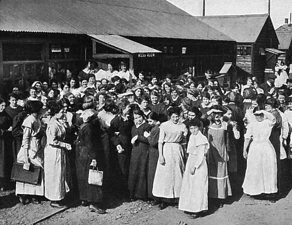 Munitions workers waiting for the tea hooter, WW1