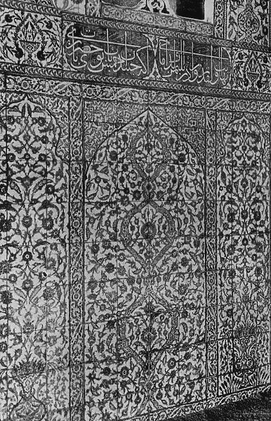 Wall of Moorish tiles with Arabic writing