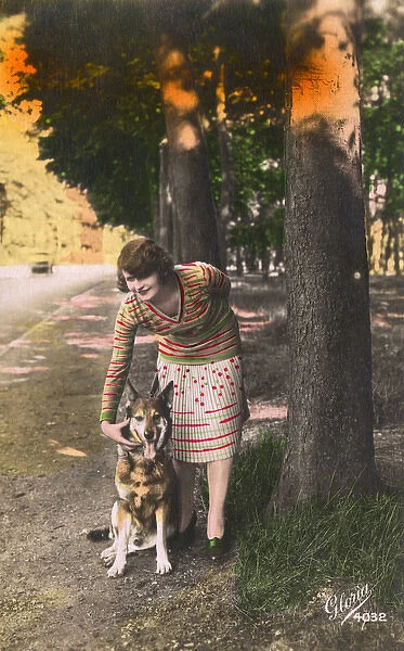 Young woman with a German Shepherd dog, France