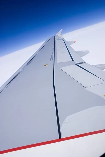 Aircraft wing and blue sky