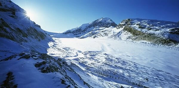 Glacier. Athabasca Glacier flowing down a mountain valley