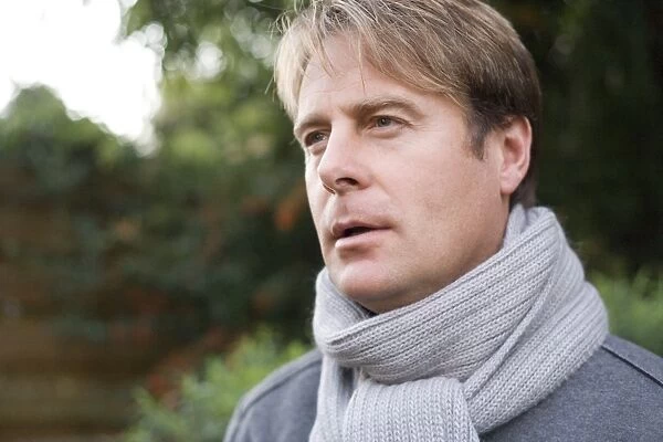 Man wearing a scarf outdoors