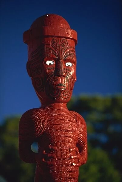 A carved figure or poupou in a Maori village at the Whakarewarewa thermal