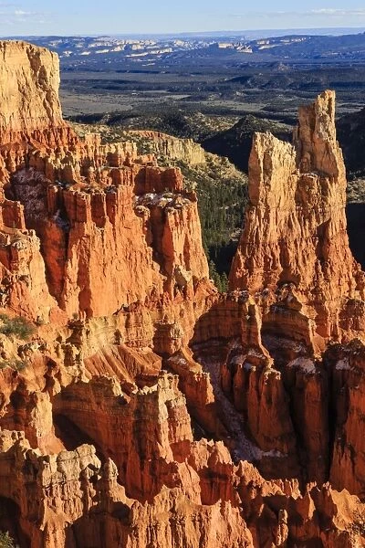 Hoodoos lit by late afternoon sun with distant view in winter, Paria View, Bryce Canyon National Park, Utah, United States of America, North America