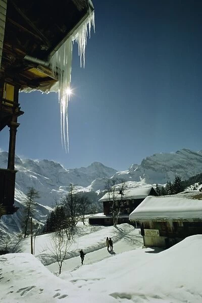 Icicles on chalet and deep snow