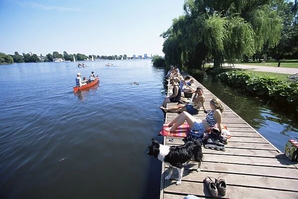 People at the Aussenalster lake in the middle of the city