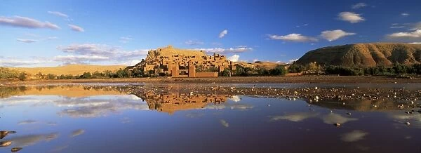 Reflections of kasbah in river