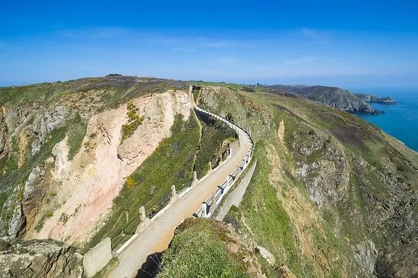 Road connecting the narrow isthmus of Greater and Little Sark, Channel Islands, United Kingdom