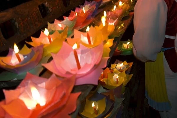 Selling floating prayer candles, night, Lijiang old town, Yunnan, China, Asia