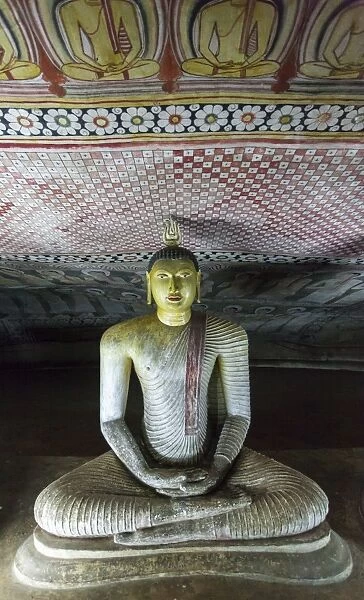Sitting Buddha statue, Royal Rock Temple, Golden Temple of Dambulla, UNESCO World Heritage Site. Dambulla, Sri Lanka, Asia