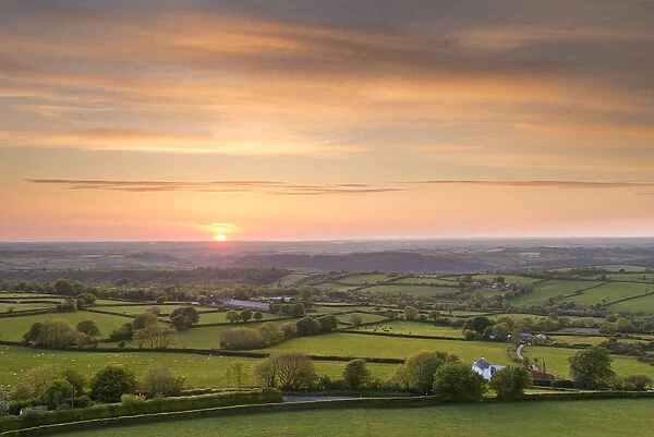 Sunset over beautiful rolling Devon countryside, Devon, England. Summer (June)