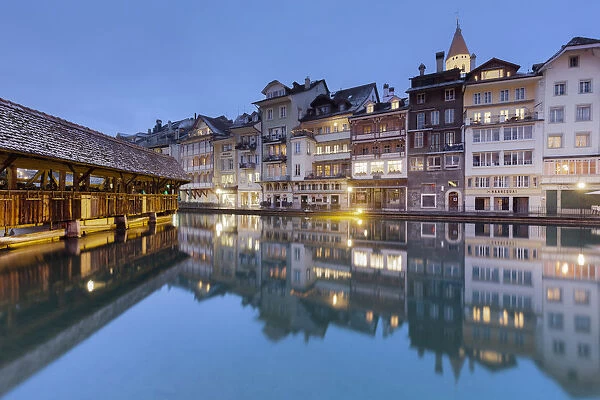 Traditional houses are reflected in the Aare river. Thun, Canton of Bern, Switzerland
