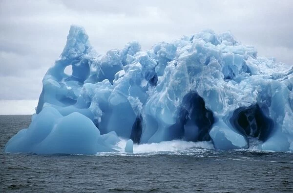 Detail of blue iceberg full of holes and cavities. Antarctic Sound, Antarctic Peninsula, Antarctica