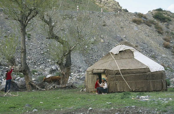 10000810. CHINA Xinjiang Tianchi Kazakh Yurt tent with women and young boy outside
