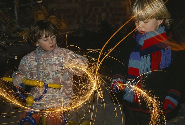 10008644. FESTIVALS Fireworks Gut Fawkes Two young children in scarfs