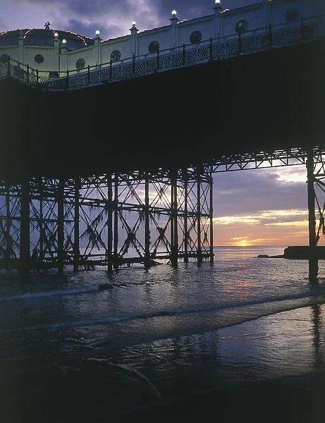 10097701. ENGLAND East Sussex Brighton Sunset seen through Brighton Pier