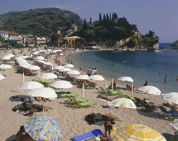 20003312. GREECE Epirus Region Parga Krioneri Beach view along busy beach with umbrellas