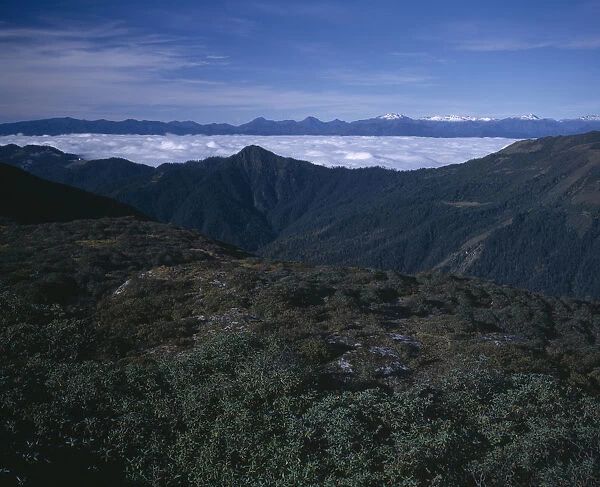 20016652. BHUTAN Simkota Tsho View from above towards mountain peaks