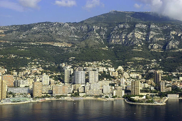 20038709. MONACO Cote d Azur Monte Carlo Aerial view from the sea toward the coastal city