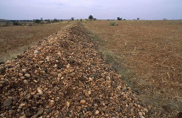20044193. INDIA Andhra Pradesh Anantapur Pebble bund made to catch rainwater runoff