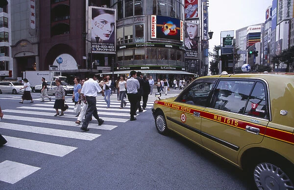 20060654. JAPAN Honshu Tokyo Ginza. Pedestrian crossing with taxi cab in the foreground