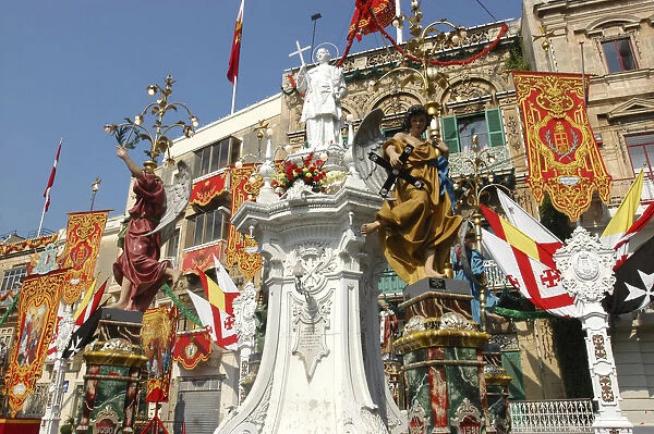 20064665. MALTA Vittoriosa Statues and decorative banners during the Birgu Feast