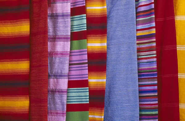 20067614. MOROCCO Essaouira Detail of colourful striped textiles. Colorful