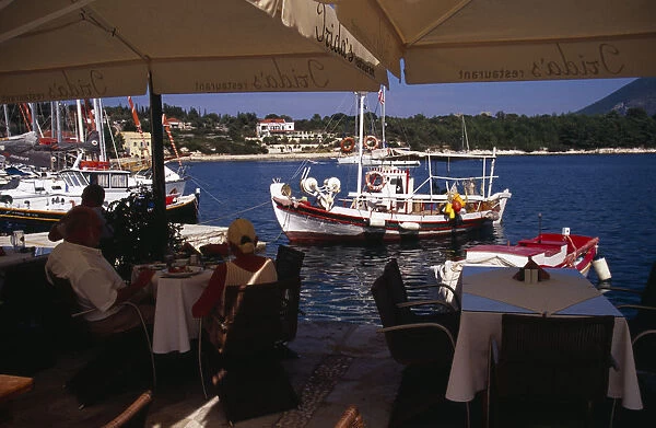 20089506. GREECE Ionian Islands Cephalonia Waterside cafe in Fiskardo harbour