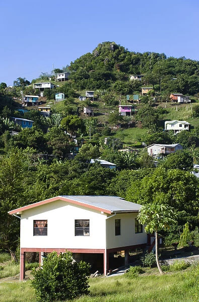 20096379. West Indies Grenada St George Houses built on stilts lining a hillside
