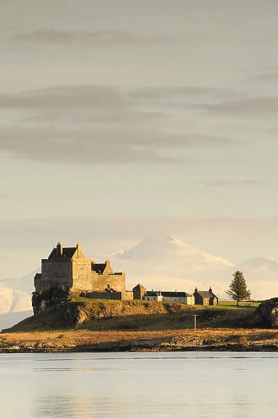 Duart Castle with snow covered Ben Cruachan behind
