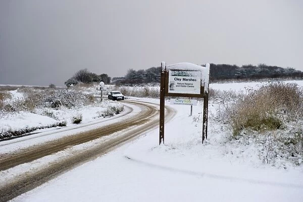A149 coast road covered in snow at Cley NWT Reserve Cley Norfolk December