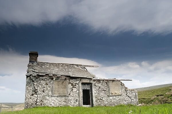 Abandoned shooting lodge on roadside of B6255 from Hawes to Ingleton, North Yorkshire, England, May
