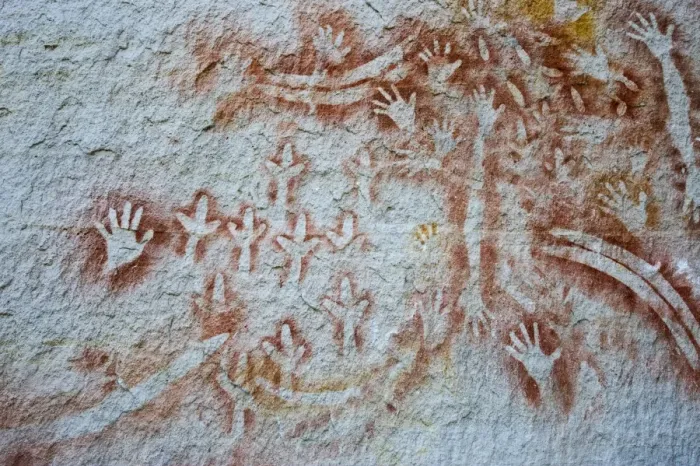 Framed Print : Aboriginal rock art, stencil art dated circa 2000 years old, showing depictions of hands, boomerangs Framed Print : Aboriginal rock art, stencil art dated circa 2000 years old, showing depictions of hands, boomerangs