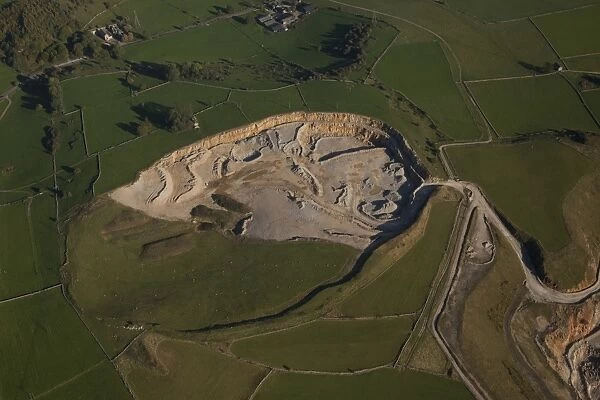 Aerial view of active limestone quarry, White Peak, Peak District, Derbyshire, England, september