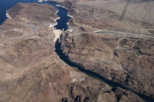 Aerial view of arch-gravity dam on river, Hoover Dam, Black Canyon, Colorado River, Arizona  /  Nevada border, U. S. A