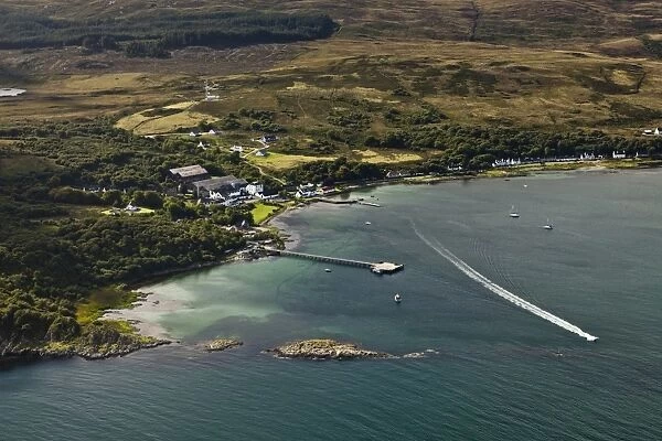 Aerial view of coastline with village and pier, Craighouse, Small Isles Bay, Isle of Jura, Inner Hebrides, Scotland