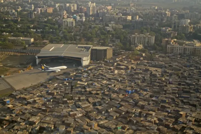Framed Print : Aerial view of slum areas surrounded by luxury apartments, offices and airport, India, February